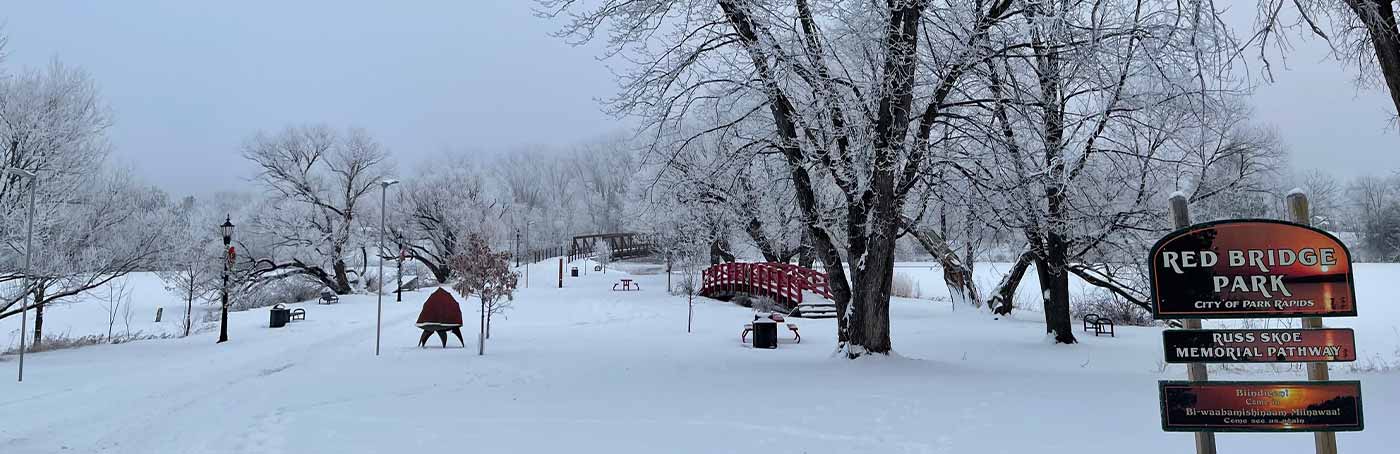 red bridge park with snowfall